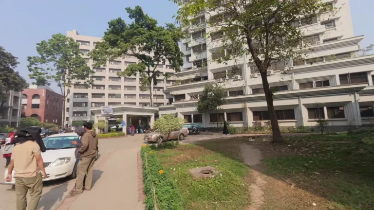 Tree-lined street and apartment blocks in Dhaka, Bangladesh
