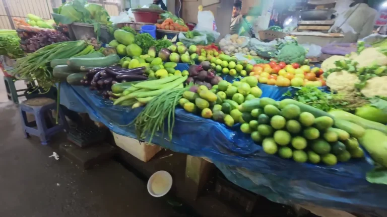 Vegetable stall piled with fresh produce in Dhaka, Bangladesh