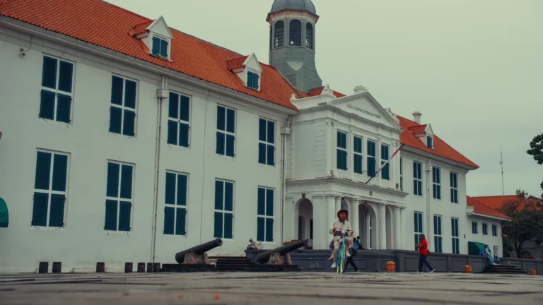 White colonial building with a clock tower in Jakarta, Indonesia