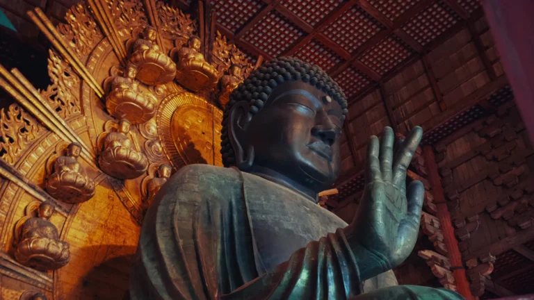 Giant bronze Buddha statue inside a temple in Japan