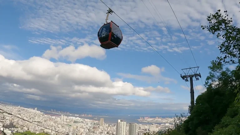 Cable car above the city and hills in Japan