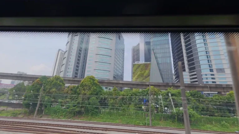 City towers seen from a train window in Kuala Lumpur, Malaysia