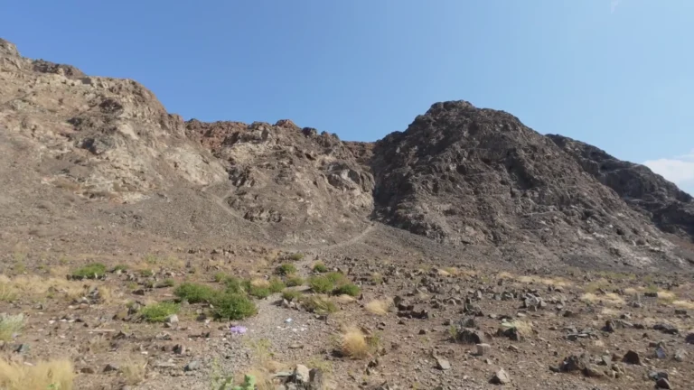 Rugged rocky hills under a blue sky in Oman