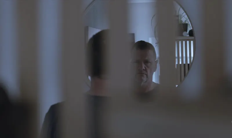 Andy Blithe film still, reflected in a mirror
