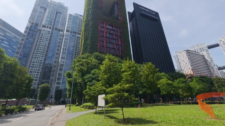 Modern towers above a green lawn in Singapore
