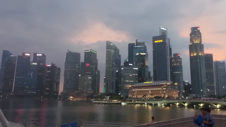 Skyline reflected in the water at dusk in Singapore