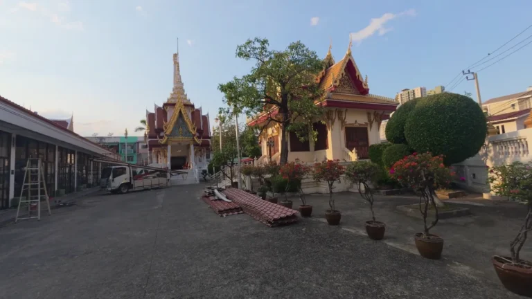 Temple grounds with spires and trees in Thailand