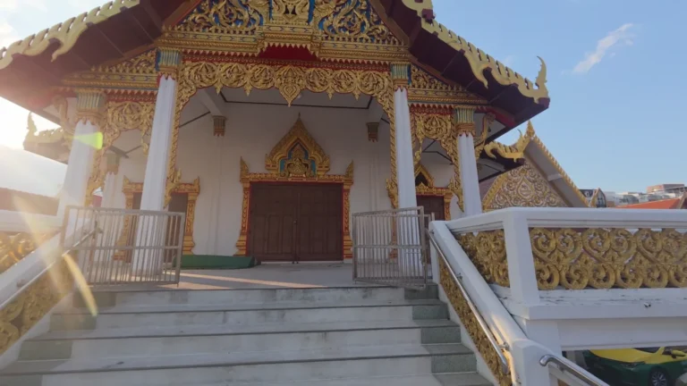 Temple entrance with ornate gold detail in Thailand
