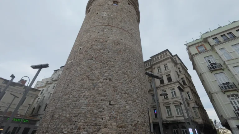 Stone tower beside old buildings in Istanbul, Turkey
