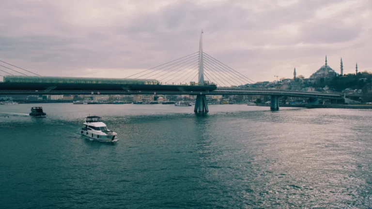 Ferry crossing below a bridge in Istanbul, Turkey