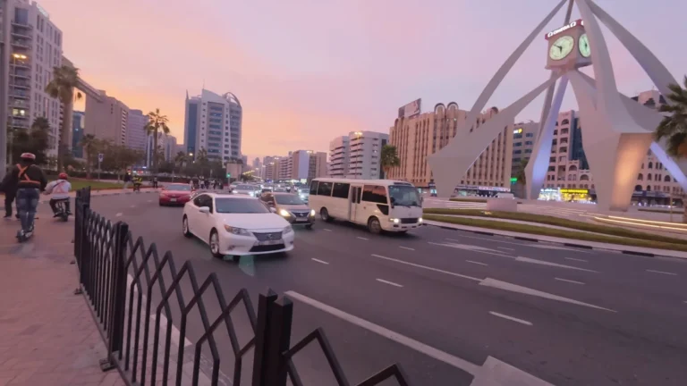 Clock tower roundabout at sunset in Dubai, UAE