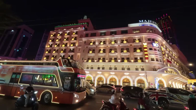 Grand illuminated hotel at night in Vietnam
