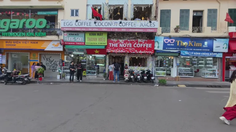 Colourful shopfronts along a city street in Vietnam