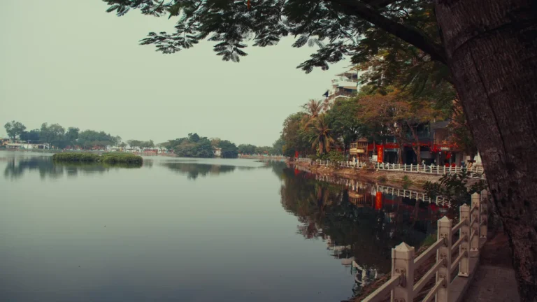 Calm lake edged with trees in Vietnam